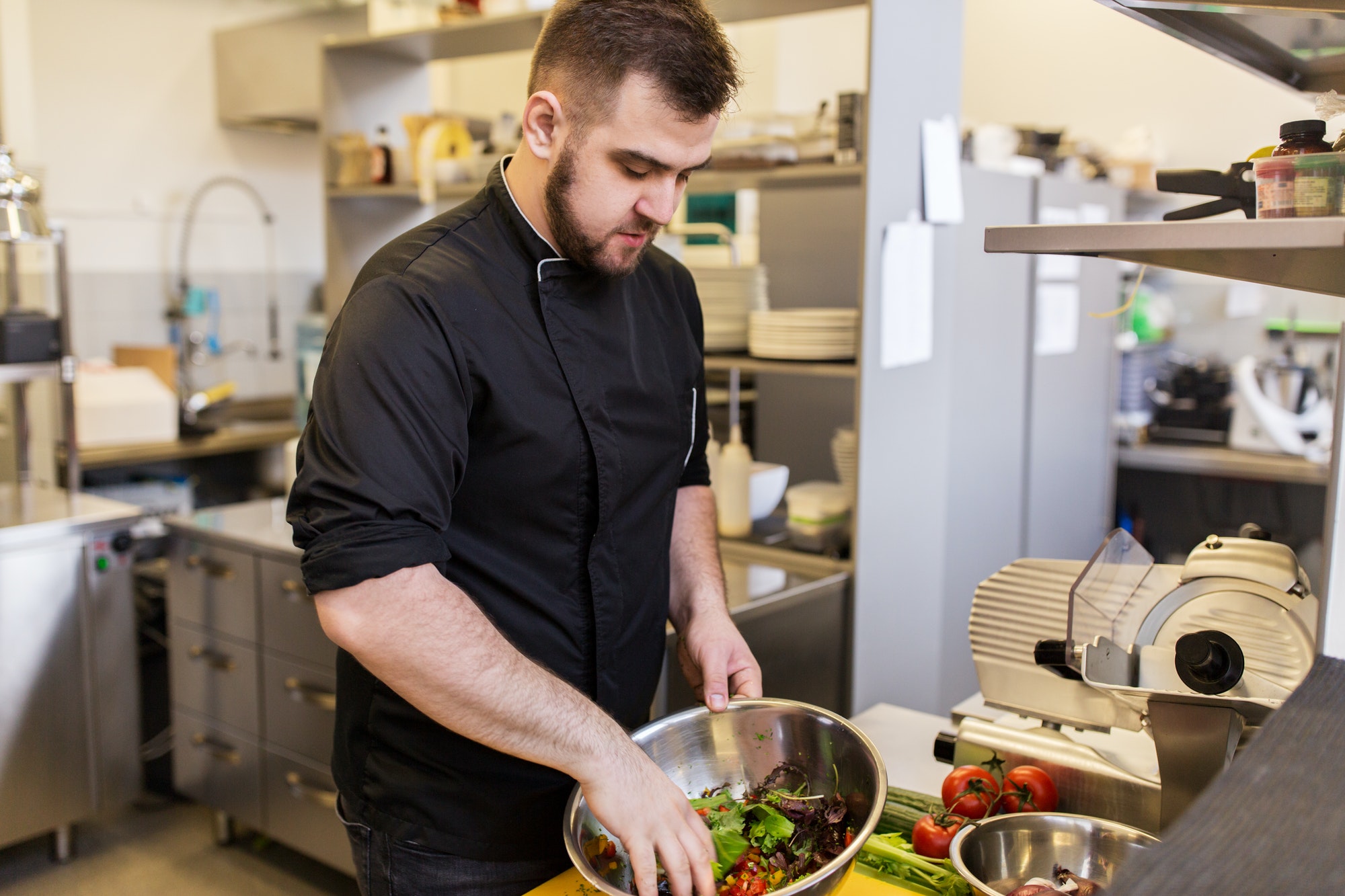 chef cook making food at restaurant kitchen