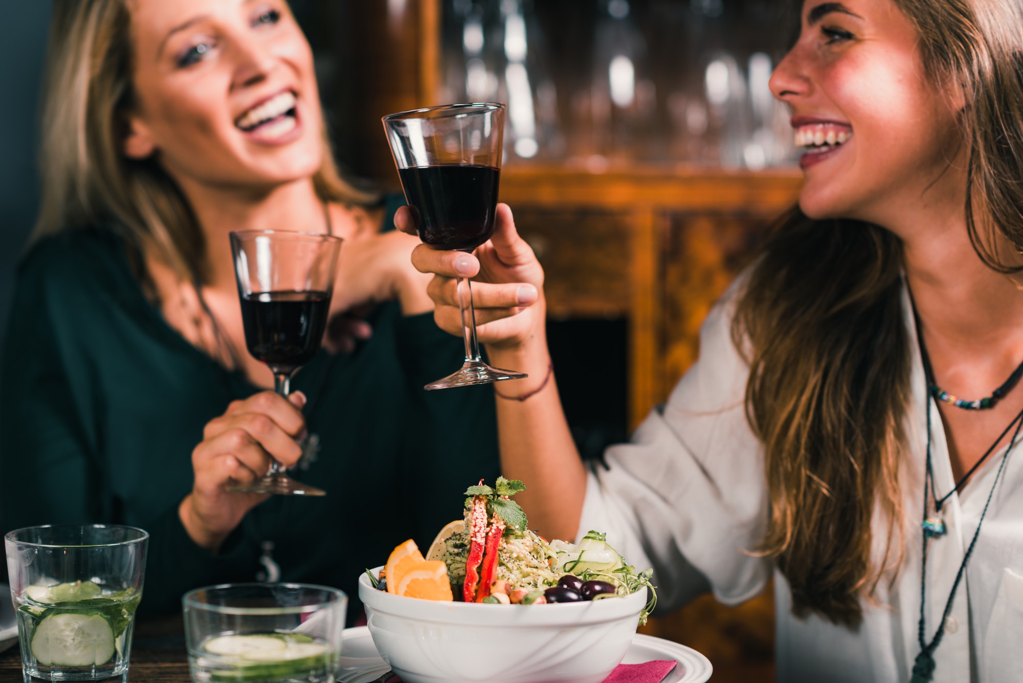 Healthy Eating. Female Friends in Vegetarian Restaurant Eating,